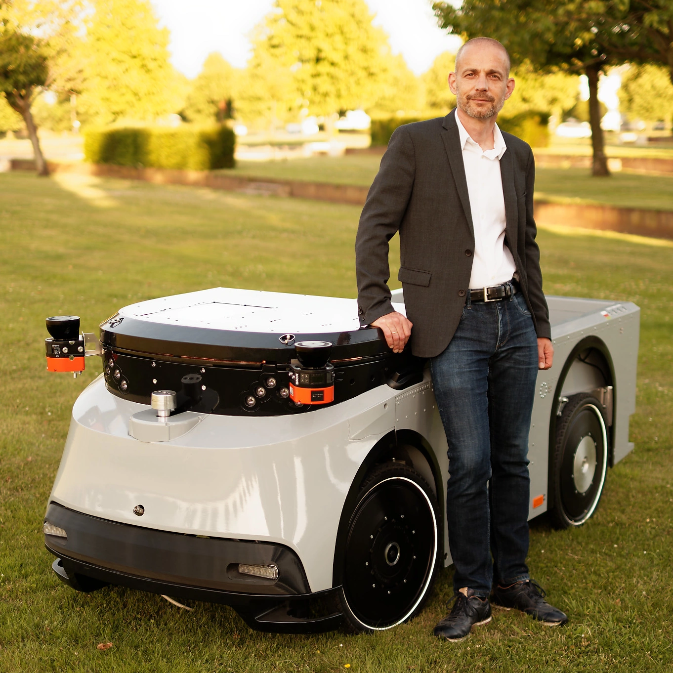 Markus Werle in front of the Ducktrain prototype vehice